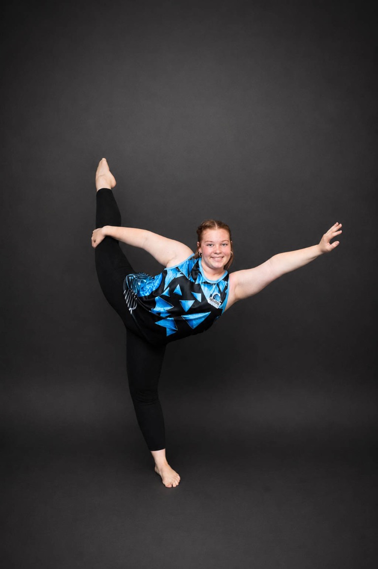 Belong dancer performing a standing flexibility pose
