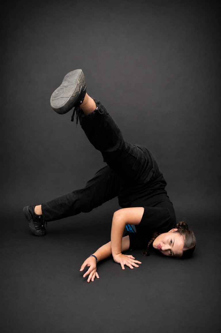 Belong dancer holding a hand-supported floor pose