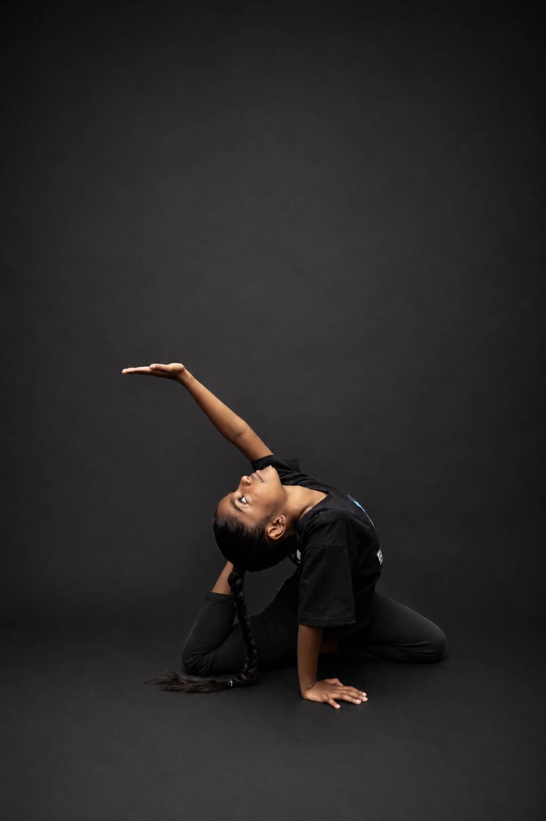 Belong dancer performing a backbend pose